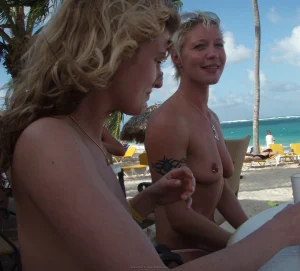 81-topless-chick-on-the-beach-shows-herself