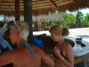 83-topless-chick-on-the-beach-shows-herself